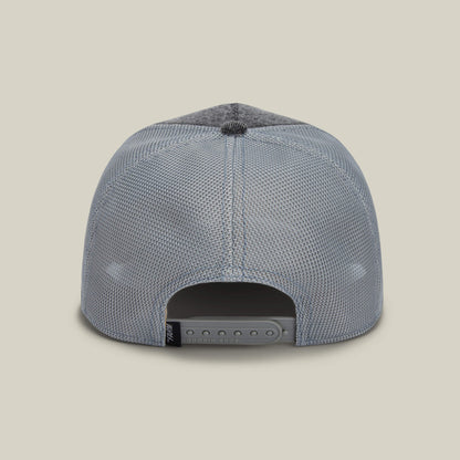 The back view of The Mamba by Goorin Bros. showcases a gray mesh snapback with an adjustable plastic strap and a black tag on the left side.