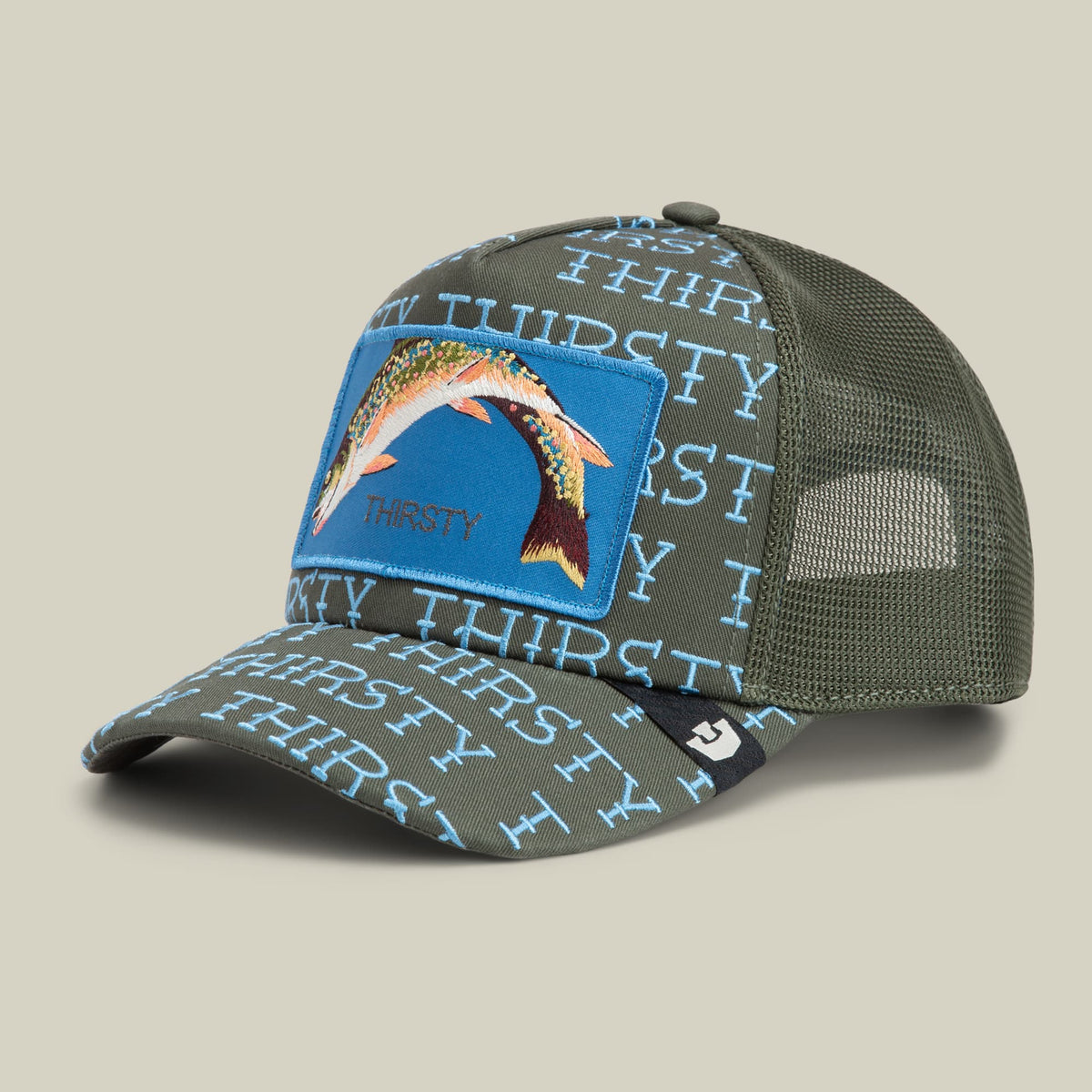 The Goorin Bros. Thirsty Thursday trucker hat features an olive green mesh back with repeating text, a blue fabric front panel with an embroidered fish graphic, and a snapback closure, displayed against a neutral studio background.