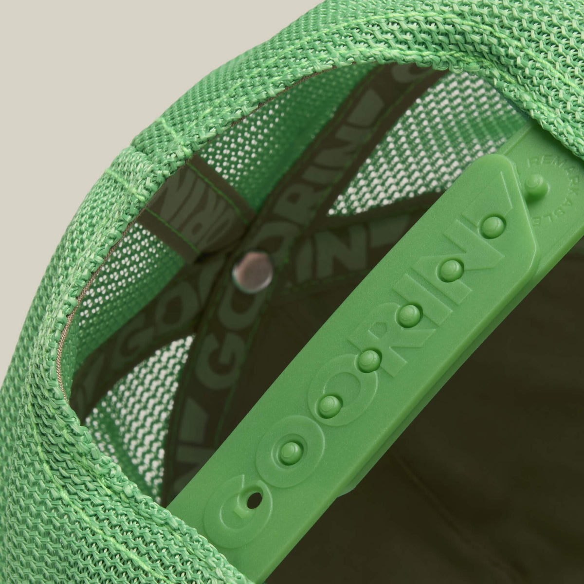 Close-up of the back of a green mesh trucker hat with an adjustable snapback strap featuring the word GOORIN. The Freaky Friday by Goorin Bros.—a fresh drop for bold weirdos eager to show their wild side.