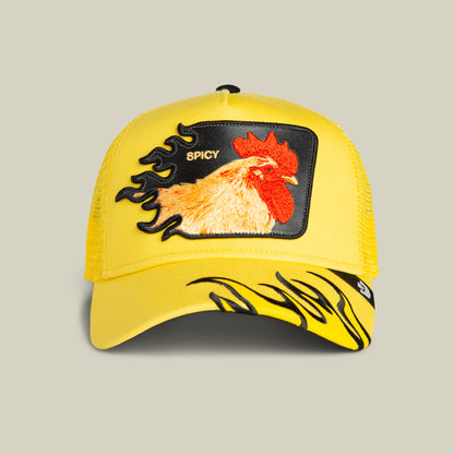The Spicy Flames trucker hat by Goorin Bros. in BEAM features yellow mesh, an embroidered rooster and spicy flames patch with "SPICY" on the front, plus a black flame design on the brim.
