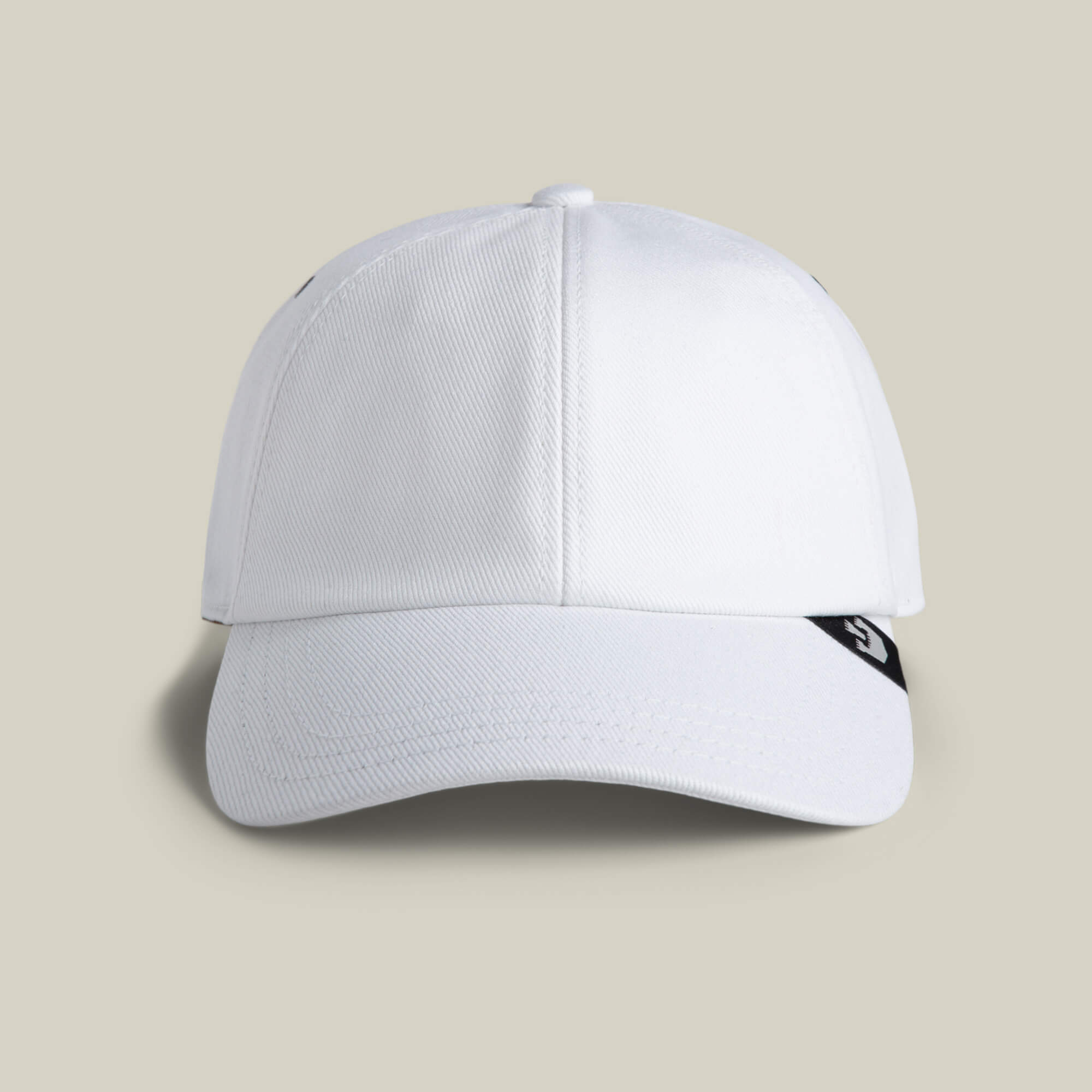 The Clean Denim Papa by Goorin Bros. is a white dad cap with a curved brim, seen from the front, and features a small black tab with a white logo on the right side.