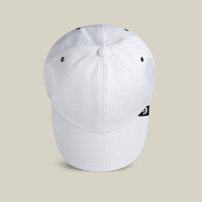 A Clean Denim Papa dad cap by Goorin Bros. is shown from above, highlighting its white top panel stitching and ventilation eyelets against a neutral background.