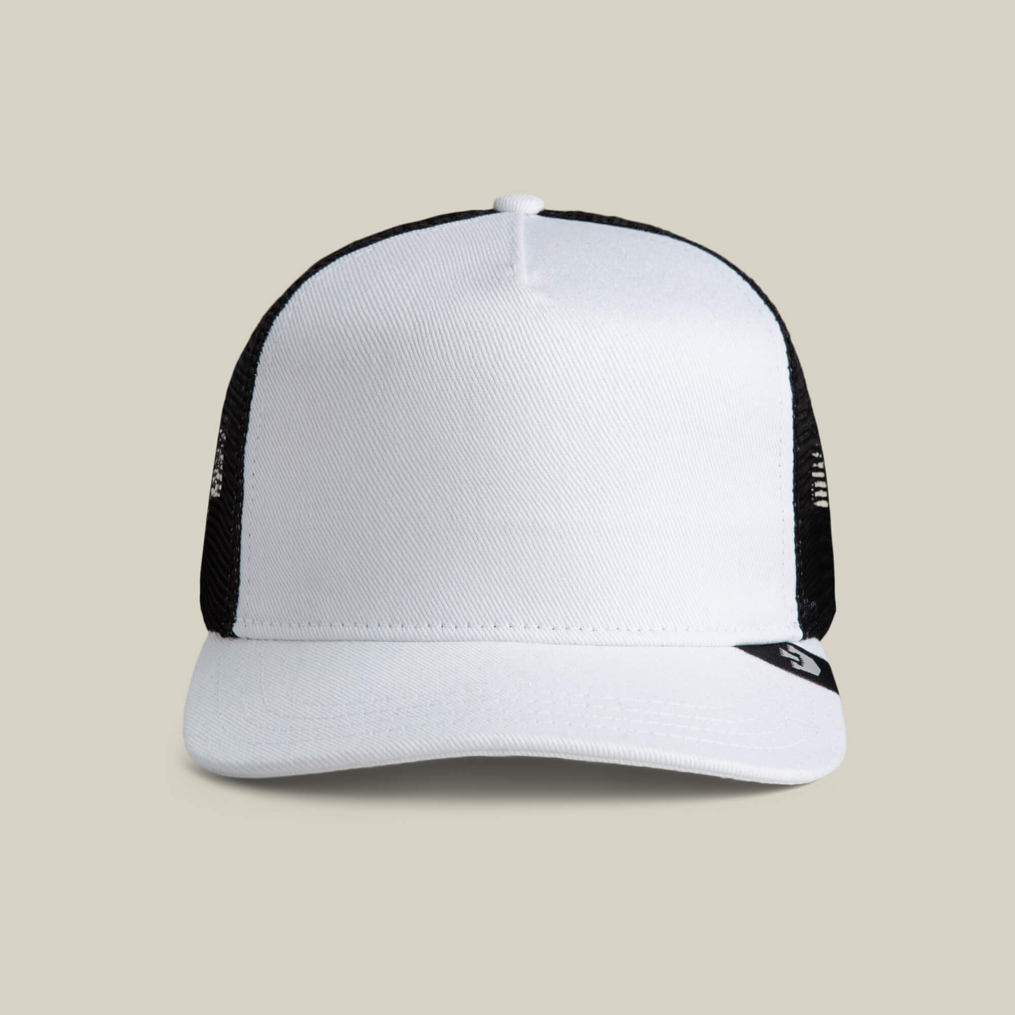 The Goorin Bros. Clean Denim Trucker hat, featuring a white front panel and black mesh back, is displayed against a plain beige background.