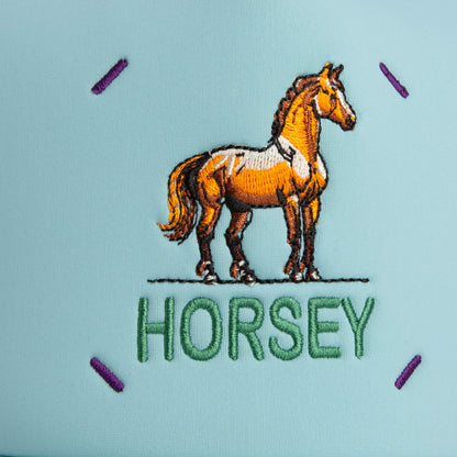 The Neo Farm - Horsey Horse hat by Goorin Bros. features an embroidered brown horse above "HORSEY" on cool blue, accented with purple corner stitching for a stylish, playful look.