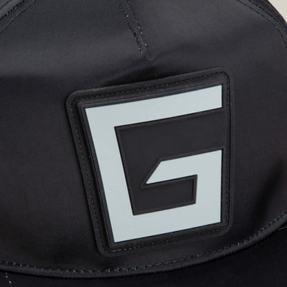 Close-up of the Pole Position - Road Kill racing cap by Goorin Bros., featuring a large, stylized letter G patch on the black front panel.