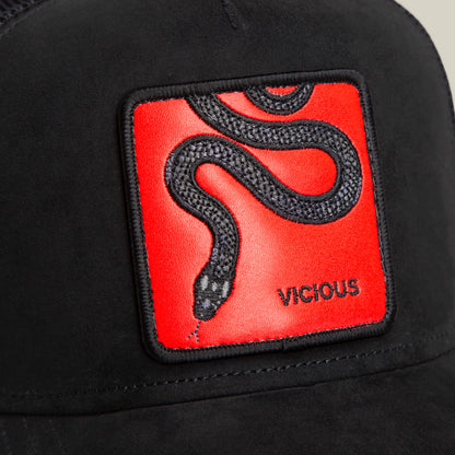 The Serpente Rosso by Goorin Bros. is a black microsuede hat with a red patch showcasing an embroidered black snake and the word VICIOUS beneath its head, symbolizing a red-hot strike.