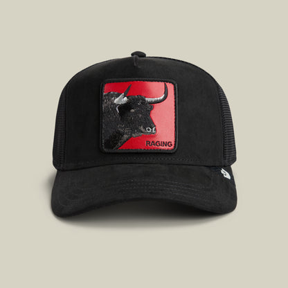 The Toro Rosso by Goorin Bros. is a black trucker hat with a rectangular patch showing a bull’s head on red and the word RAGING below, embodying Toro Rosso's bold, powerful spirit.