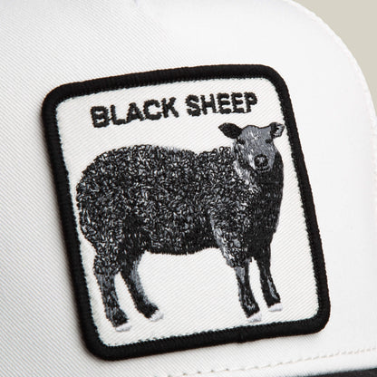 The Suede Sheep hat by Goorin Bros. is white with a black sheep patch in a rectangular design and "BLACK SHEEP" embroidered above it, all in classic black and white.