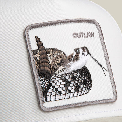 Close-up of the Goorin Bros. Suede Rattlesnake hat, featuring a white cap, suede brim, embroidered rattlesnake patch, and "OUTLAW" stitched in the upper right corner.