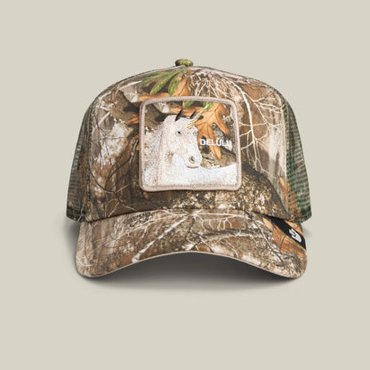 The Goorin Bros. Realtree Edge Delulu Unicorn is a camouflage mesh trucker hat with a square unicorn patch and “DELUSION”—perfect for adding unexpected whimsy to your outfit.