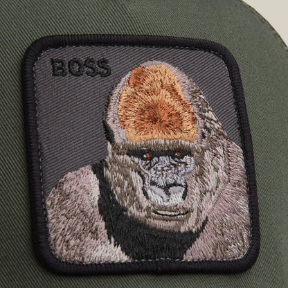 The Goorin Bros. Boss Trucker hat features a bold fabric gorilla patch with "BOSS" embroidery on deep olive, making it a standout accessory.