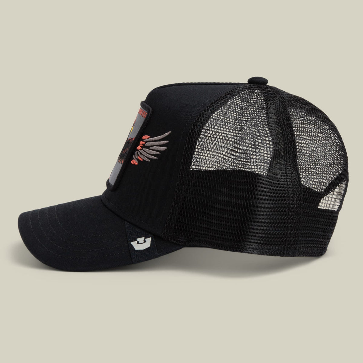 Wings Forever black trucker hat with mesh back, featuring red and gray embroidered wings design on the front panel and adjustable snapback closure, shown in side view against neutral background.