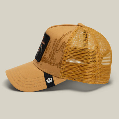 The Badlands Scorpion by Goorin Bros. is a yellow mesh trucker hat featuring a front patch, a cactus graphic on the side, and a small black and white logo tag on the brim, displayed against a neutral background.