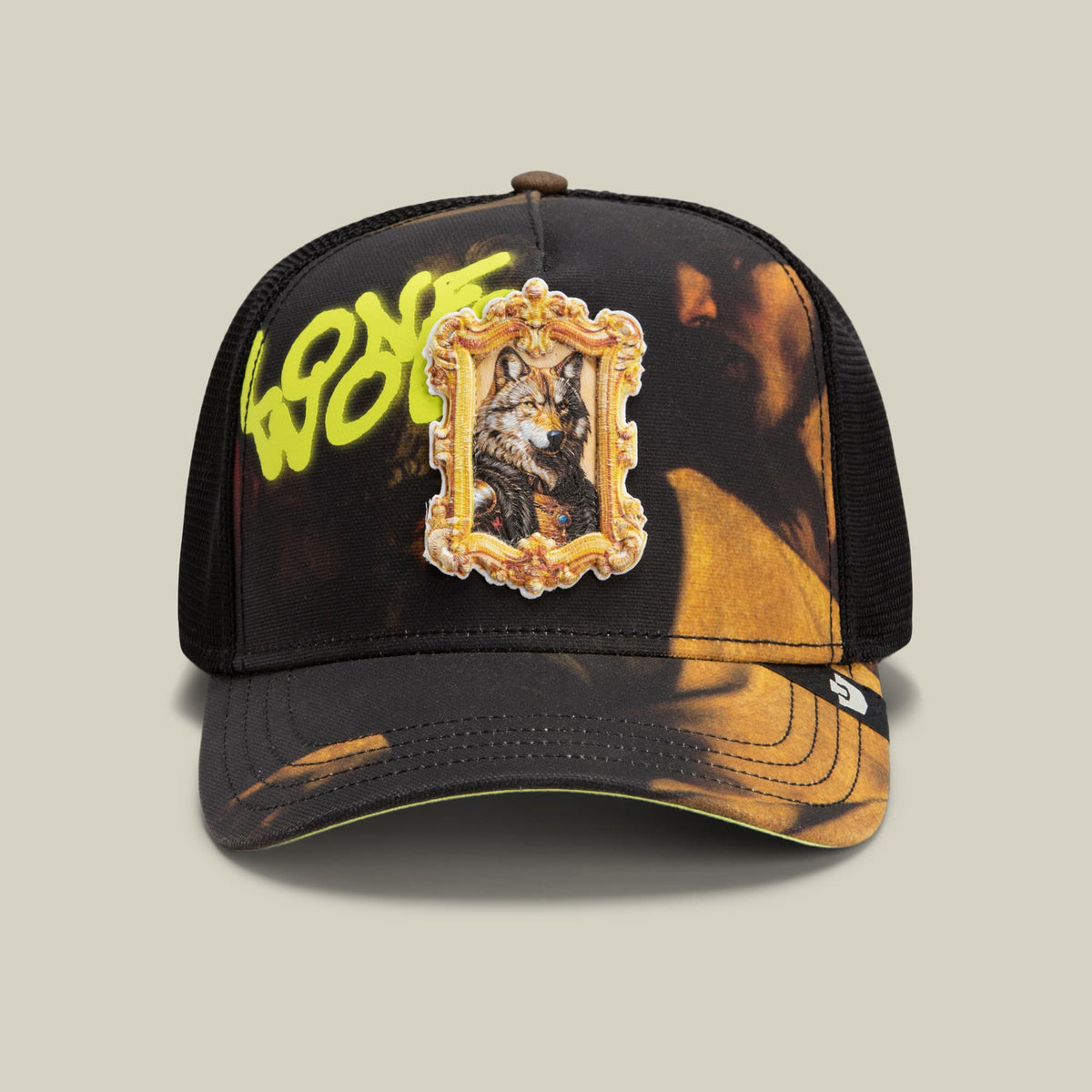 The Coming of Saint Matthew trucker hat by Goorin Bros features a black mesh design with gold and orange tie-dye accents, yellow text, and an ornate framed portrait embroidery on the front, displayed against a neutral background.