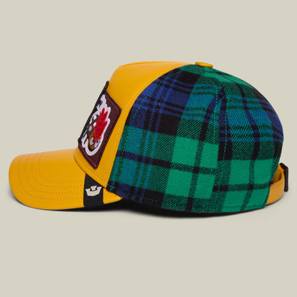 Bugger! by Goorin Bros. trucker hat with yellow quilted front panels, green and navy tartan plaid back, black mesh side panels, and embroidered patch detail, shown from the side on a neutral background.