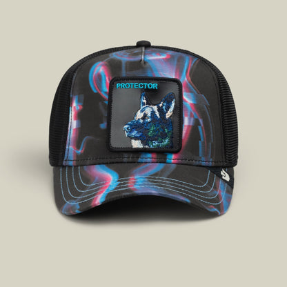 The Goorin Bros. Baba Yaga trucker hat features a black mesh back, holographic neon blue and pink swirl pattern on the front panels, and an embroidered wolf patch with cyan text reading "Protector" displayed against a neutral studio background.