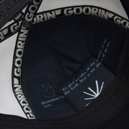 Close-up of the inside of the Goorin Bros. "R U Done Eating?" hat, featuring the brand logo on the inner band and a detailed tag, exuding a refined, classic style.
