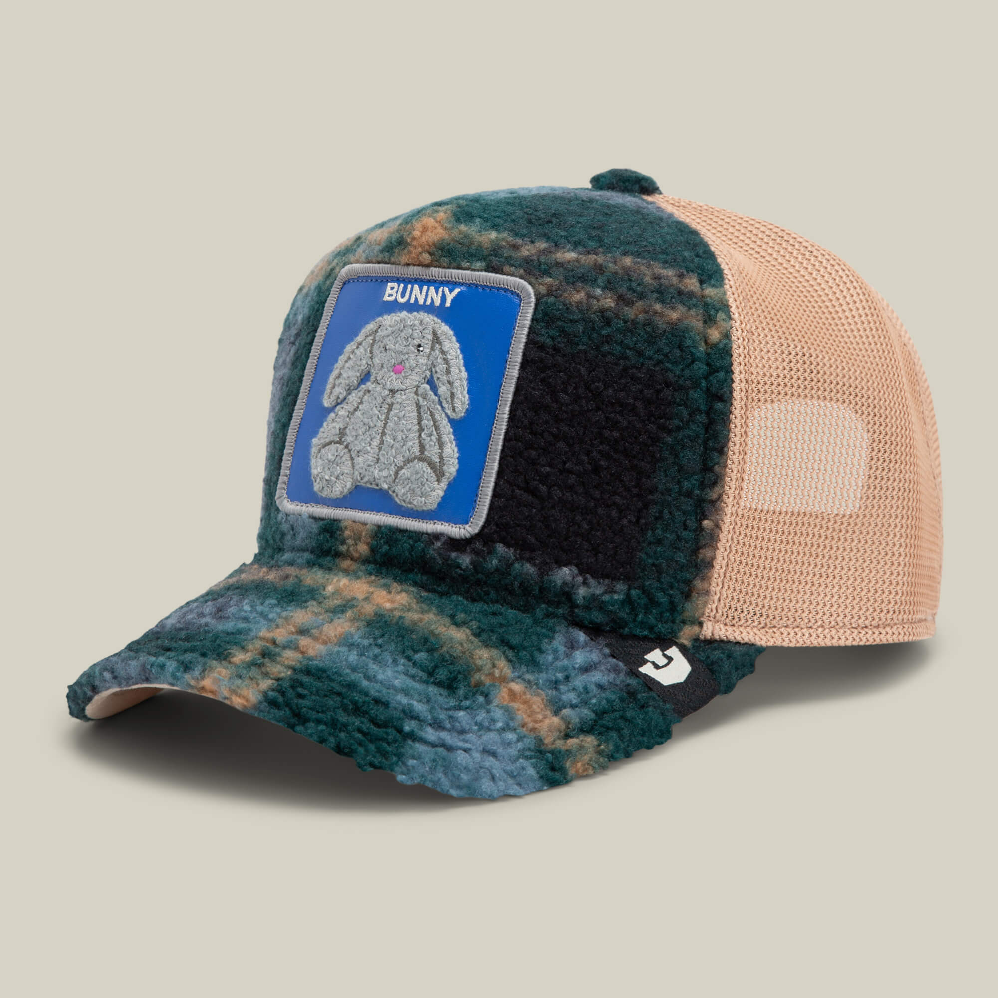 The Double Stuffed - Bunny trucker hat by Goorin Bros. features a green and tan plaid design with a mesh back, adjustable snapback, a plush chenille bunny patch, and the word "BUNNY" on the front.
