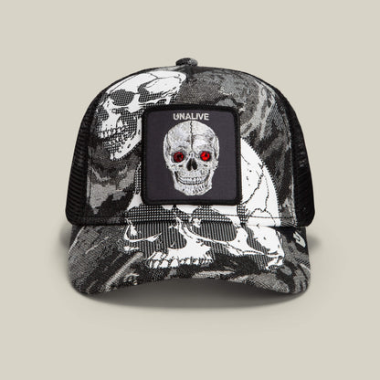 The Goorin Bros. Bone Head Unalive trucker hat in Void features a striking black and white skull print with vivid red eyes, a bold “UNALIVE” patch above the graphic, and a skull pattern across the front and brim. Finished with a breathable mesh back for all-day comfort, this classic design expertly combines edgy style with signature Goorin Bros. craftsmanship.