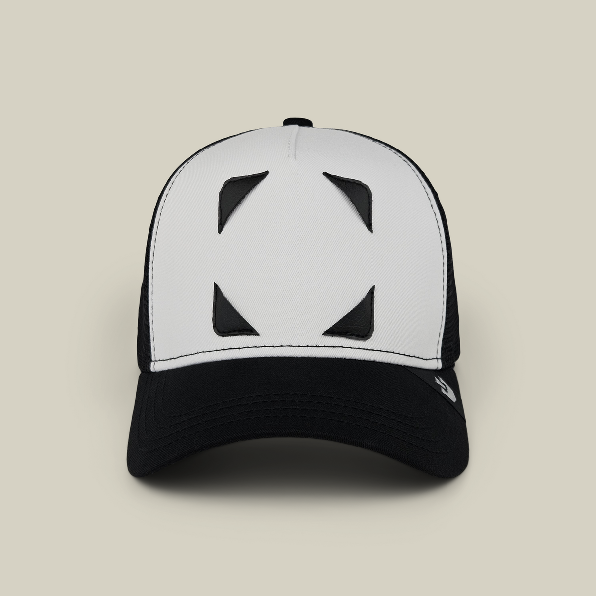 Black and white Nocturnal Patch Pack with GB Patch Corner Trucker hat featuring four black triangular patch corners on the front panel.