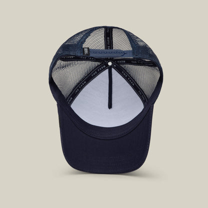 A navy blue Goorin Bros. Karlsson Moose trucker hat shown from the inside, featuring a mesh back, adjustable snap closure, interior branded lining, and a lid style perfect for fans of Rickard Rakell.