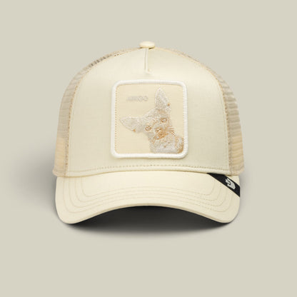 The Goorin Bros. Tonal Amigo trucker hat in cream features a mesh back, embroidered patch on the front, and snapback closure, shown on a neutral background.