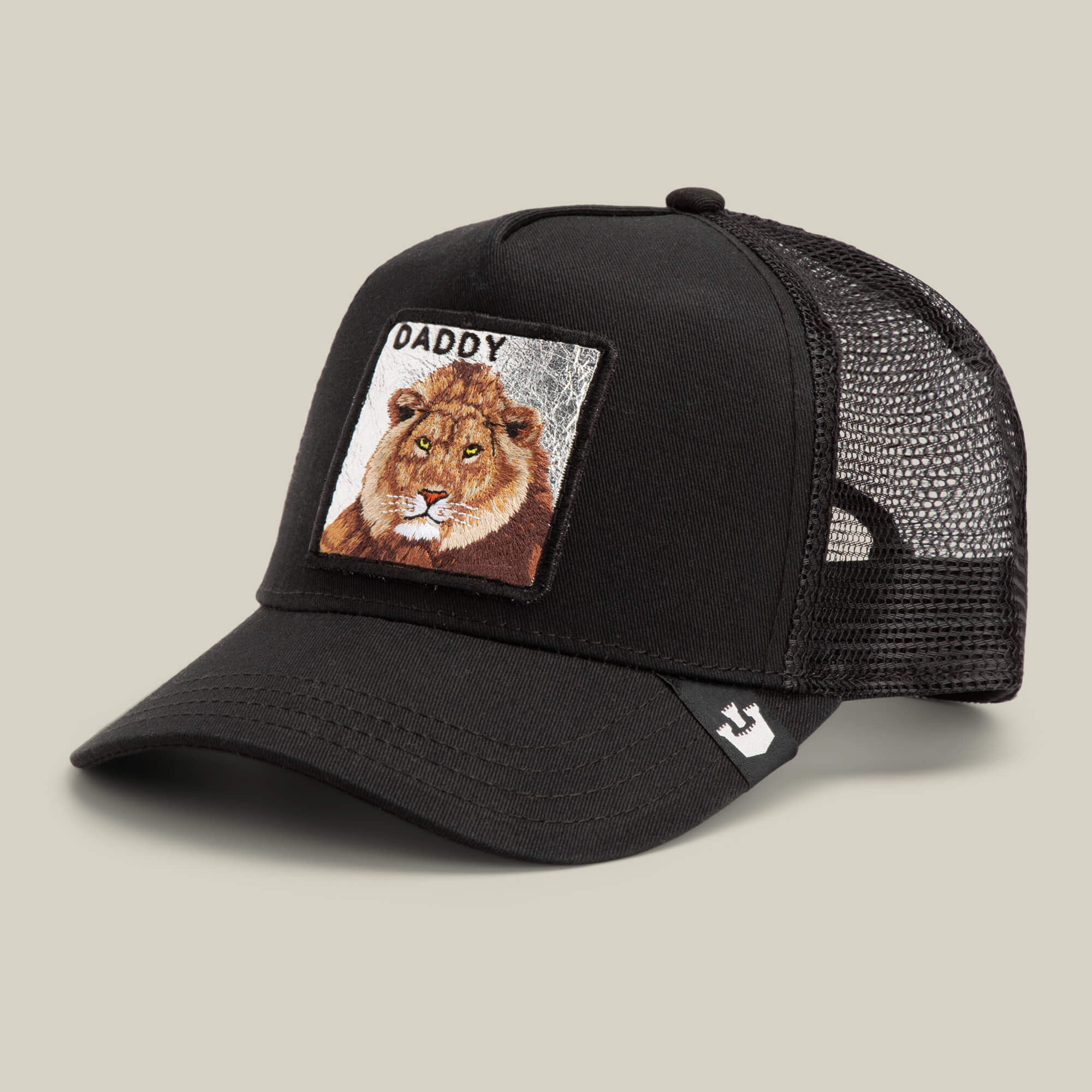 The Daddy King by Goorin Bros. is a limited edition black mesh trucker hat with an embroidered lion patch and "King Daddy" text on the front panel.