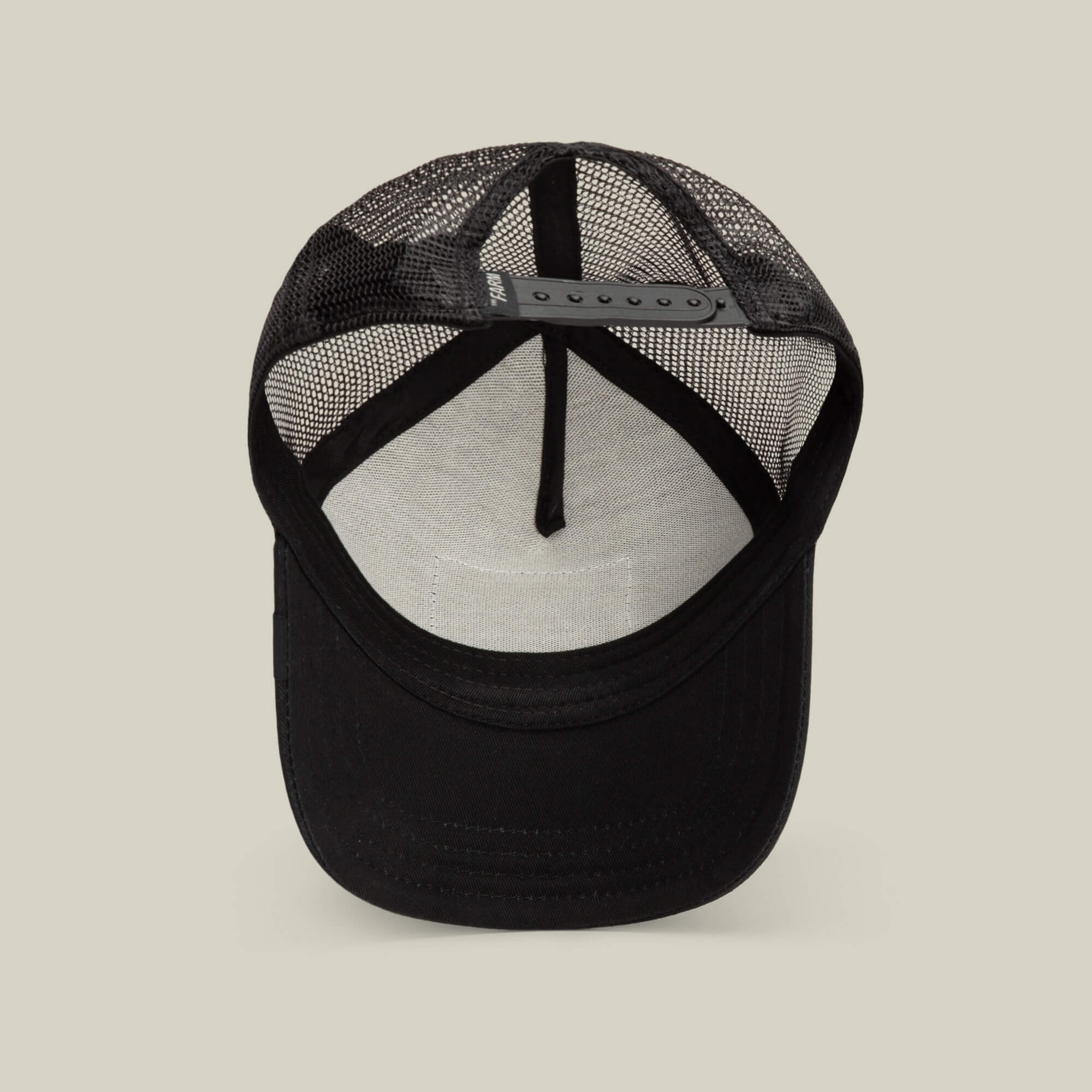 Shown from below, the Daddy King black mesh trucker cap by Goorin Bros. highlights its adjustable strap and white inner sweatband. This limited edition design offers comfort and style with breathable mesh for all-day wear.