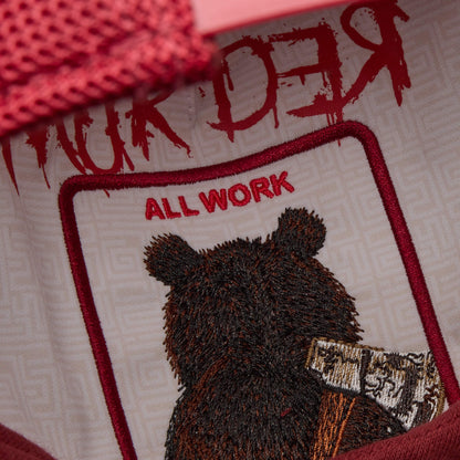 Close-up of Goorin Bros.' Dull Boi patch: an embroidered bear inspired by Johnny, with “ALL WORK” above and “MURDER” in red on top. The bear rests an axe on its shoulder—part of our All Work and No Play Fresh Friday Drop.