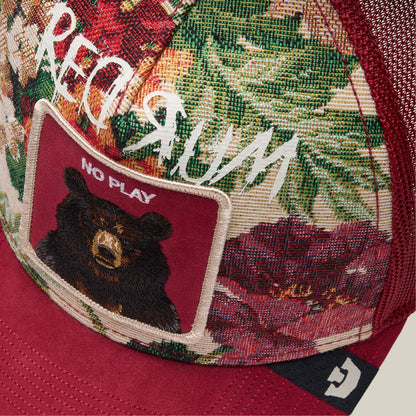 A close-up of the Goorin Bros. Dull Boi cap from the Fresh Friday Drop shows a floral pattern, a patch with a bear and "All Work and No Play," and the word "MURDER" mirrored in bold above the patch.