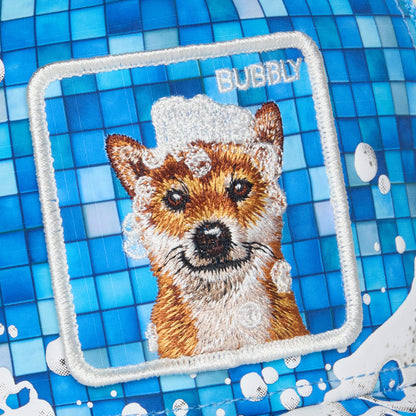 Featuring Goorin Bros.’ "Squeaky Clean," this design showcases an embroidered dog surrounded by soap bubbles and the slogan SQUEAKY CLEAN on a blue tiled backdrop, evoking a playful bath time scene for your pup.
