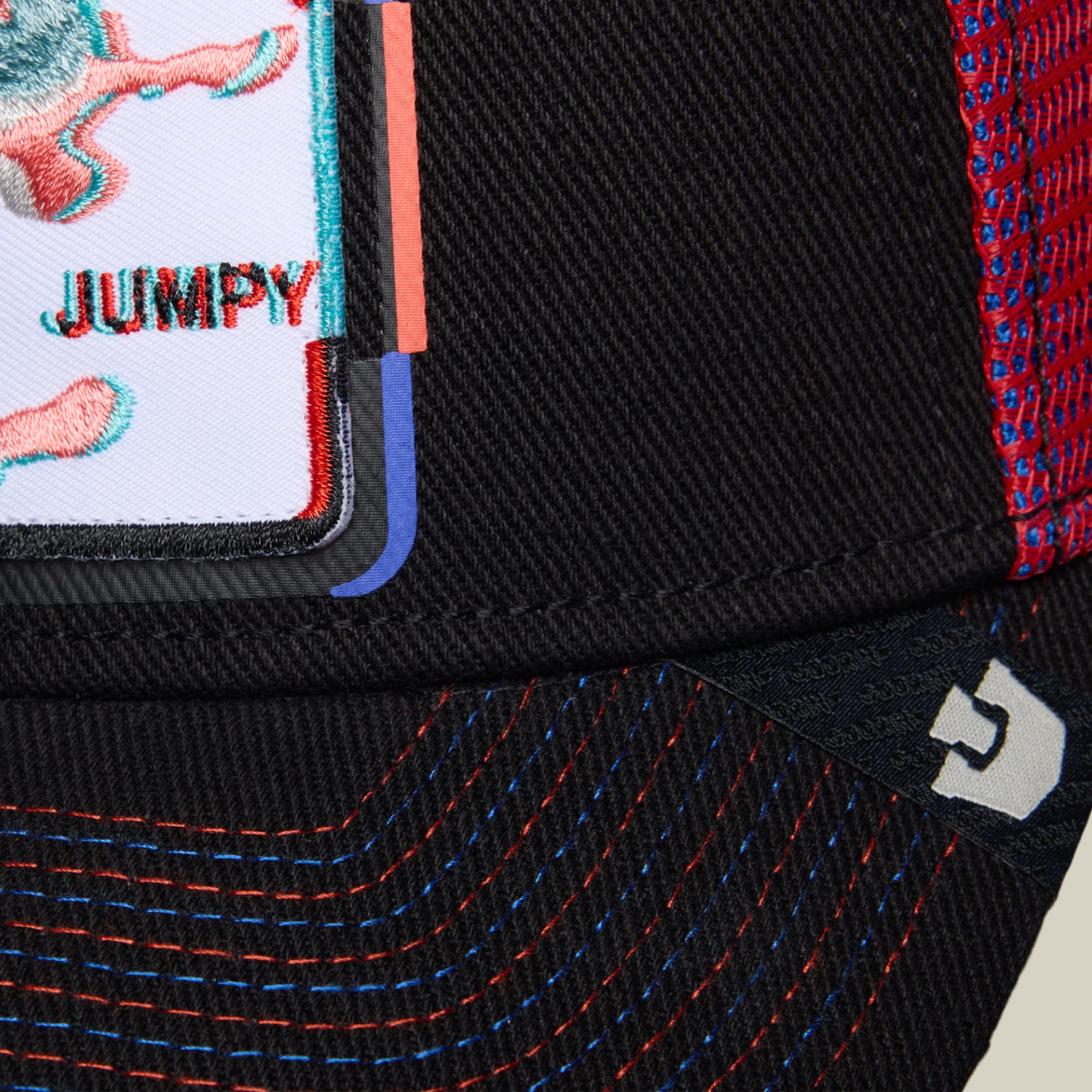 The Goorin Bros. Bug Fixes black trucker cap features colorful embroidered insects and text on the front panel, with red and blue decorative stitching detail visible on the back.
