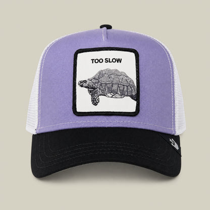 A Lavender Purple trucker cap from Goorin Bros. called “Down Low...” features a patch with a turtle and the words TOO SLOW on the front—an elusive drop that serves as a true badge of honor for any collection.