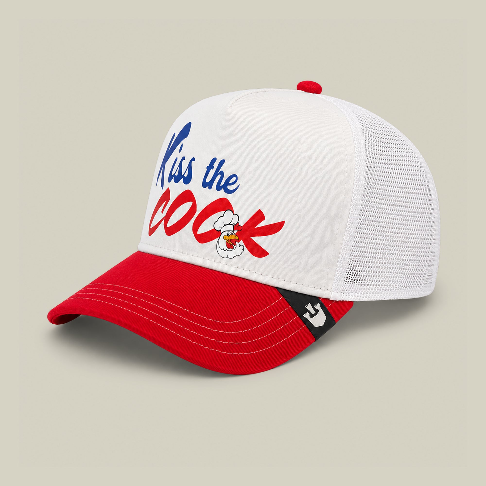 The Chef's Kiss trucker hat by Goorin Bros. features a white and red design, mesh back, and front panel with "Kiss the COCK" in bold blue/red letters plus a cartoon rooster—ideal for grillmasters or backyard barbecues.