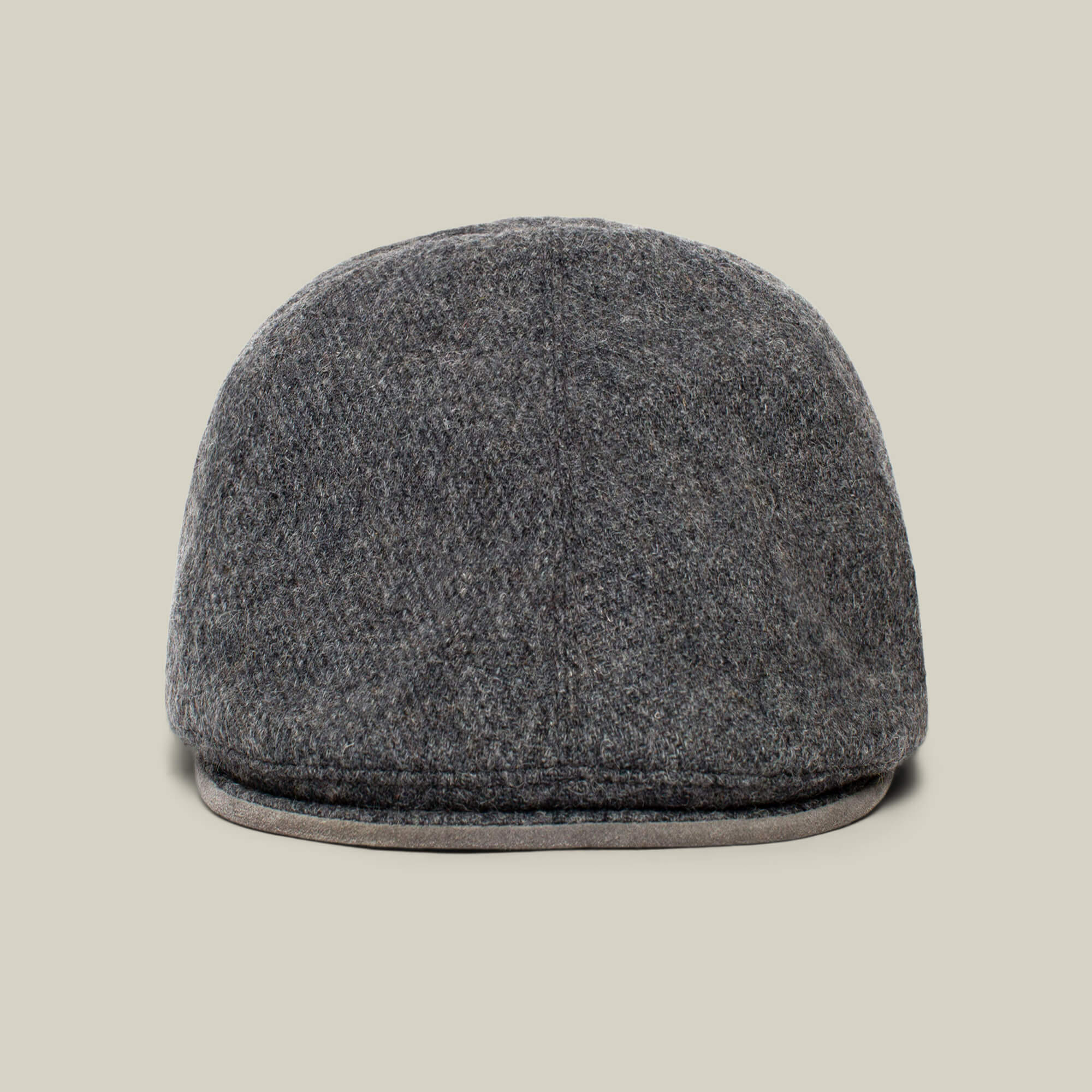 The Ronald Amos cap by Goorin Bros. is displayed from the front against a beige background, showcasing its stylish brim and classic six-panel grey wool design—ideal for everyday wear.