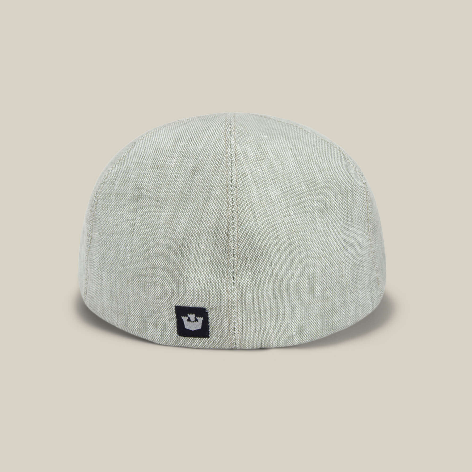 The Benjamin Paul by Goorin Bros. is a light gray linen hat seen from the back, featuring a small black square logo near the bottom center—perfect for everyday wear in three seasons.