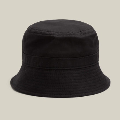 A Goorin Bros. Odyssey Bucket hat in VOID, crafted from black cotton fabric, displayed against a neutral beige background.