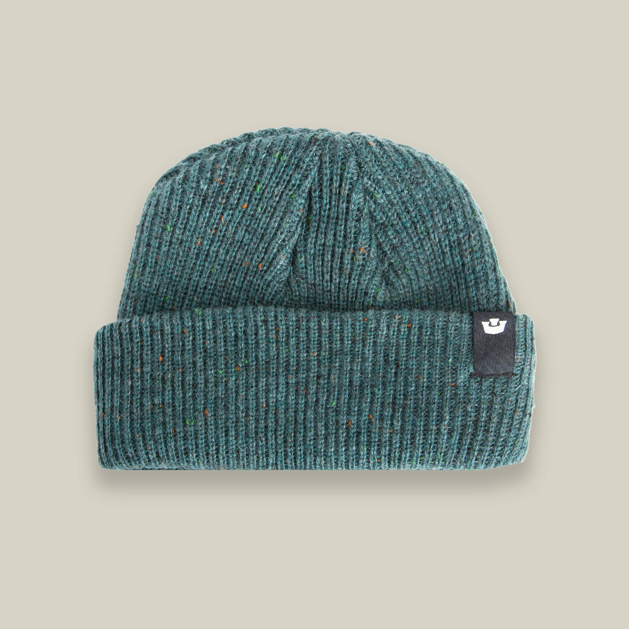 The No Comply beanie by Goorin Bros. is a warm teal knit with a folded brim and a small black logo tag on the right side, shown on a neutral background—ideal comfort for chilly days.