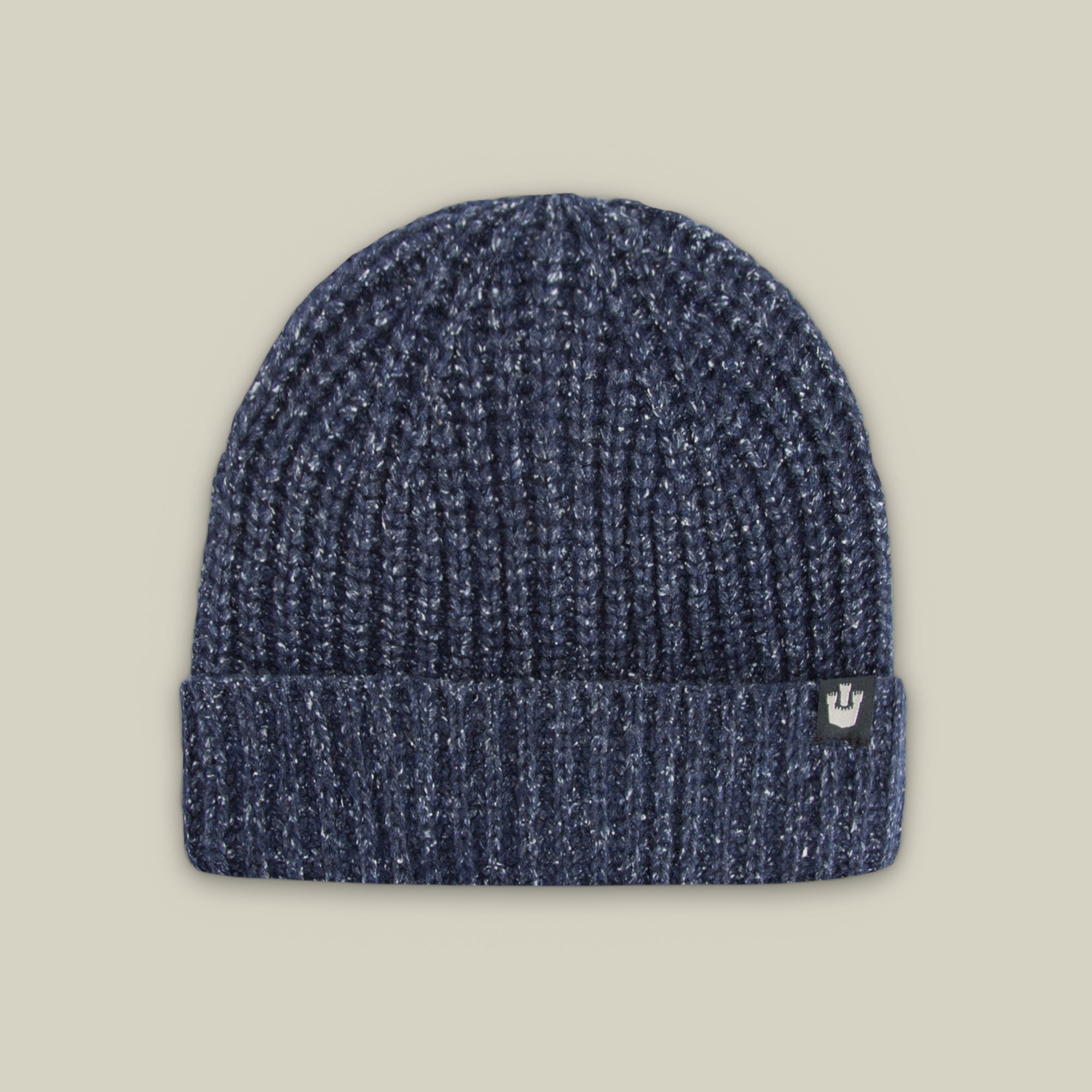 The Goorin Bros. Northstar is a dark blue ribbed knit beanie featuring a folded cuff and a small rectangular logo tag on the left side.