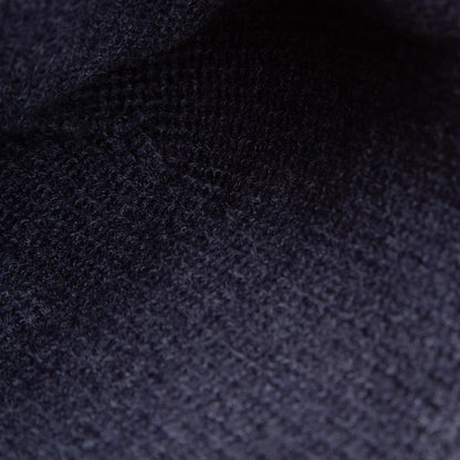 Close-up of The High Class Beanie by Goorin Bros.—a navy knit winter hat that showcases its detailed pattern and premium texture, ideal for those seeking luxury.