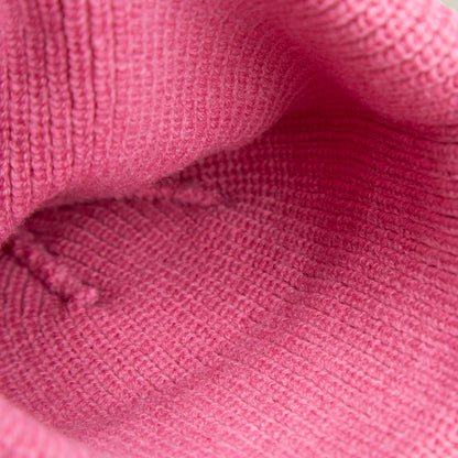 Close-up of the interior of The Queen Beanie by Goorin Bros., highlighting the detailed pink knit texture and stitching.