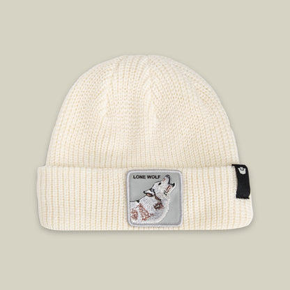 The Lone Wolf Beanie by Goorin Bros. is a DUST-colored winter hat with a howling wolf patch reading "LONE WOLF" and a small black tag on the cuff.