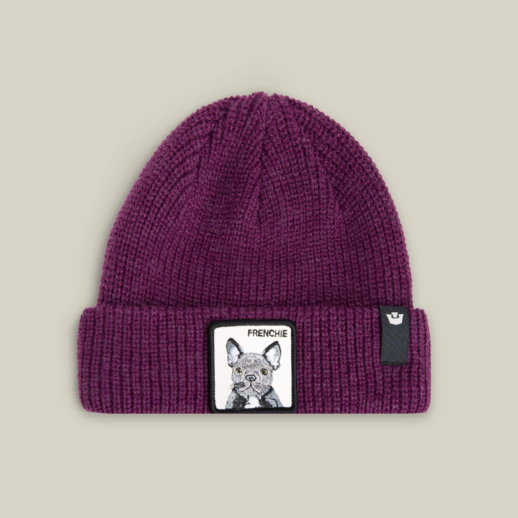 The Frenchie Beanie by Goorin Bros. is a plum knit beanie with a front patch featuring an illustrated French Bulldog and "FRENCHIE" text—ideal for cozy, trendy street style.