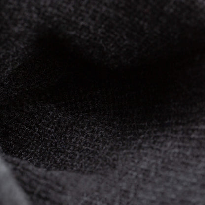 Close-up of The Savage Beanie by Goorin Bros.—a black knit hat with detailed texture and visible fibers that highlight its cozy craftsmanship.
