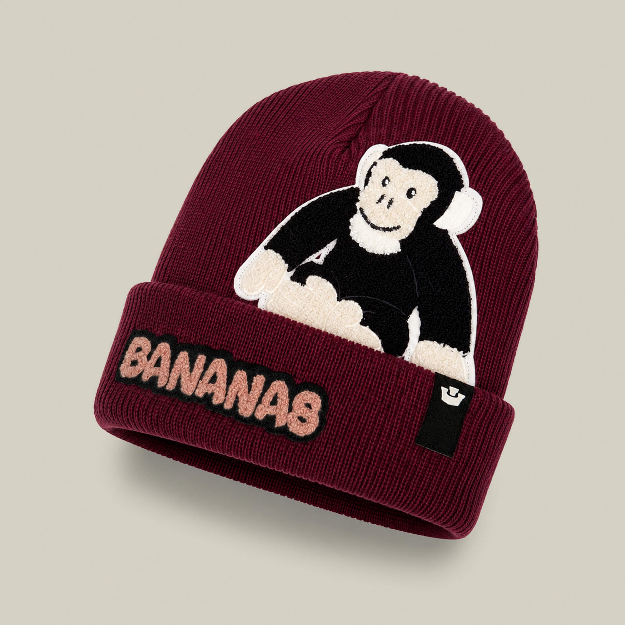 Keep cozy and stylish with the Goorin Bros. Double Stuffed - Bananas Beanie - big, a maroon knit beanie featuring double-layer warmth, a playful cartoon monkey in headphones, and “BANANAS” embroidered on the front cuff. This statement hat is perfect for cold-weather days, bringing fun flair to your winter wardrobe.