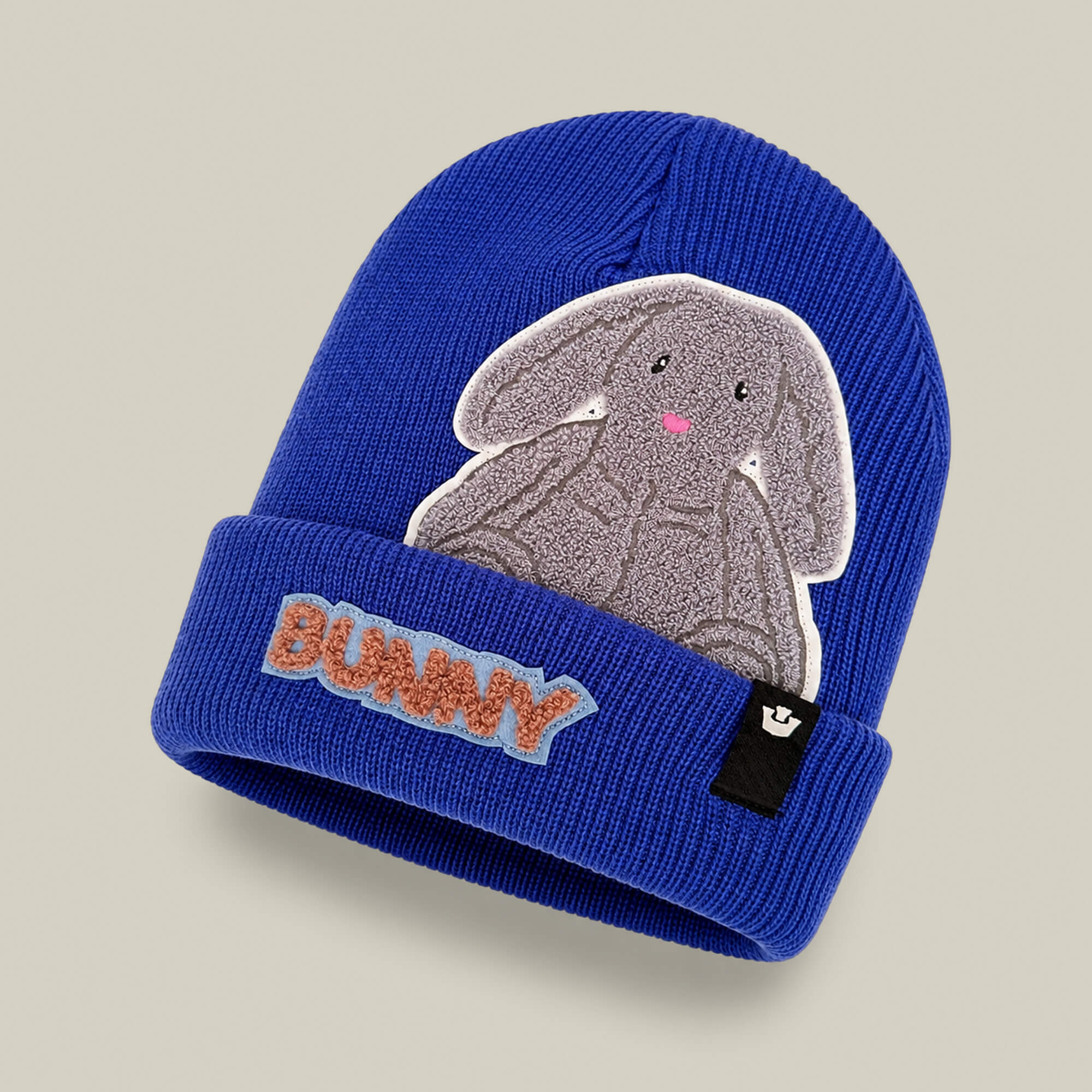 The Double Stuffed - Bunny Beanie - big by Goorin Bros. is a blue heavyweight knit beanie featuring a gray bunny patch and “BUNNY” embroidered in orange and blue on the front cuff, designed for extra warmth.