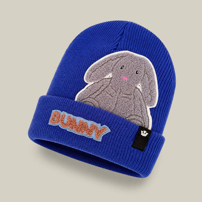 The Double Stuffed - Bunny Beanie - big by Goorin Bros. is a blue heavyweight knit beanie featuring a gray bunny patch and “BUNNY” embroidered in orange and blue on the front cuff, designed for extra warmth.