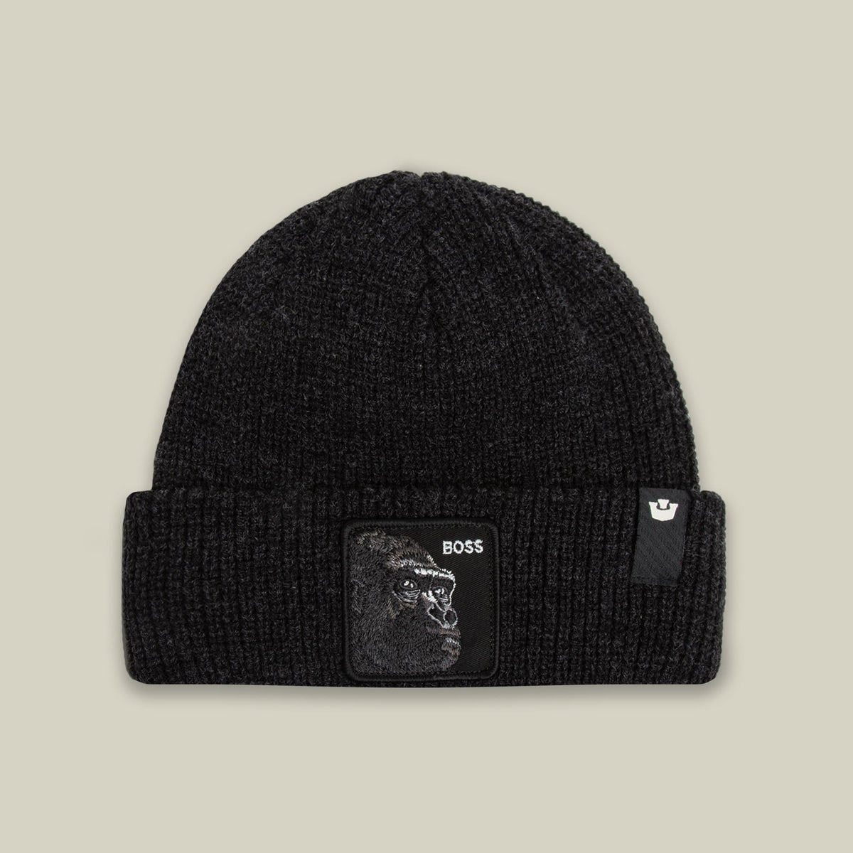 The Boss Beanie by Goorin Bros is a black ribbed knit beanie featuring a woven patch with a gorilla graphic and BOSS text on the front, displayed against a neutral background.