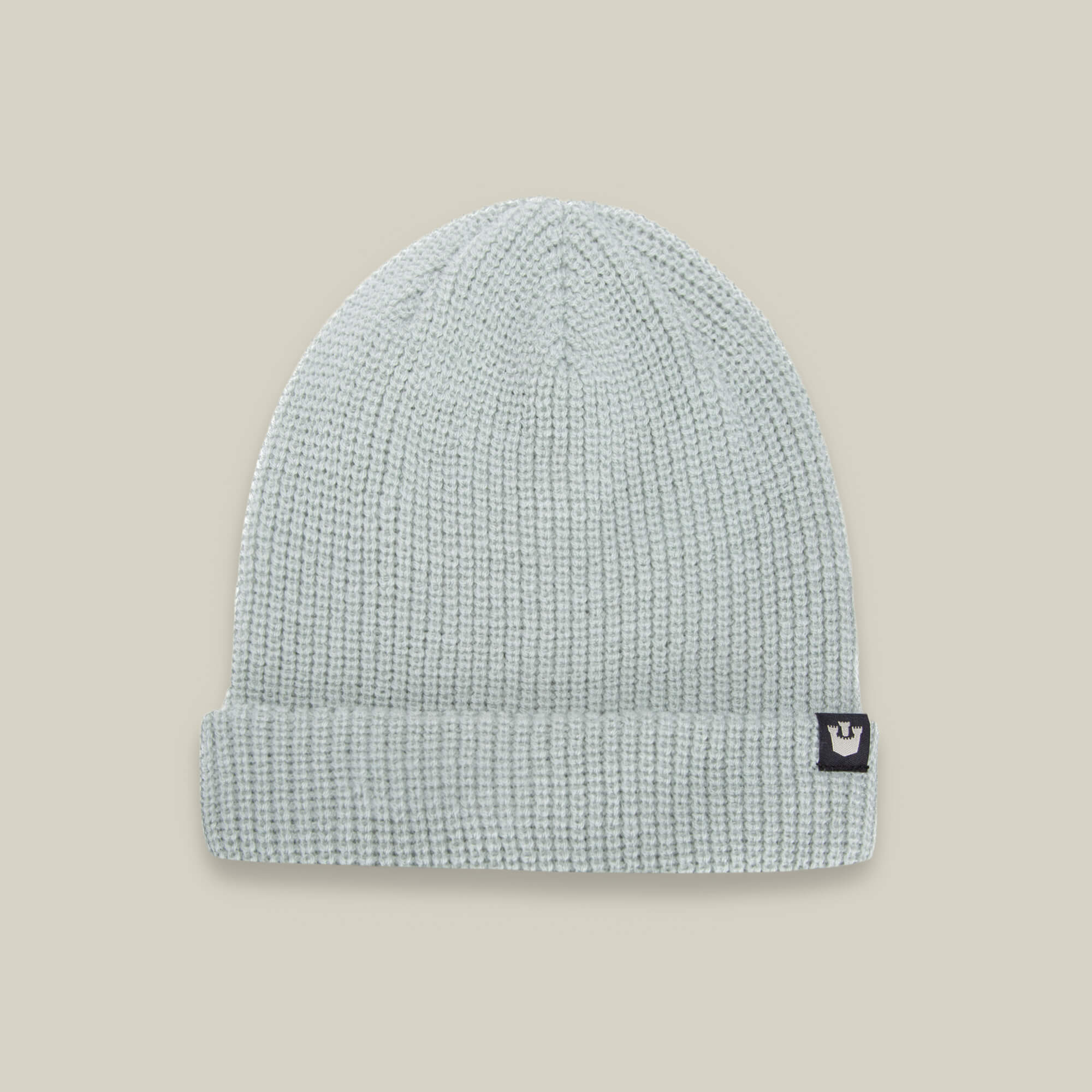 The Goorin Bros. Air to Fakie beanie in light grey is a lightweight poly knit accessory with a folded brim and a black patch featuring a white crown logo—perfect for all seasons.