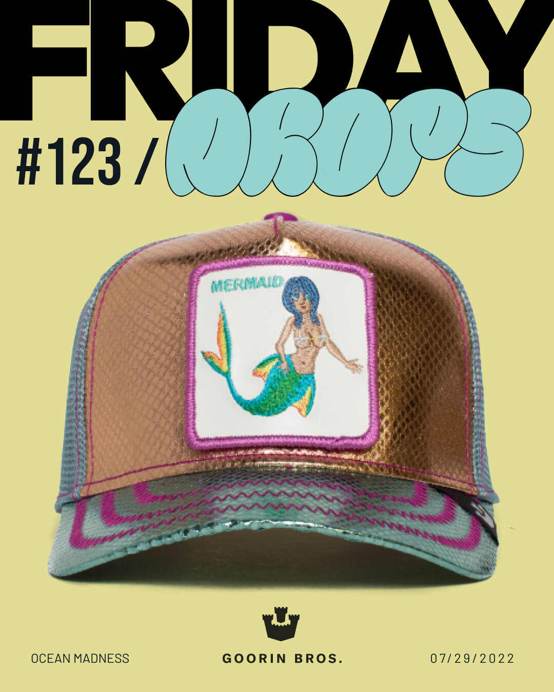 A metallic hat by Goorin with a patch of a blue-haired mermaid on the front is displayed under bold text reading FRIDAY DROPS #123. The background is light yellow.